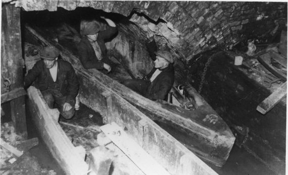 Photo of miners in boats in the underground canals of the Worsley colliery
