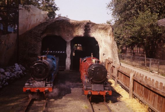 Photo of 'Railway Queen' and 'Joan' outside the tunnel-cum-shed on the miniature railway, 1977. Copyright Jon Cocks.